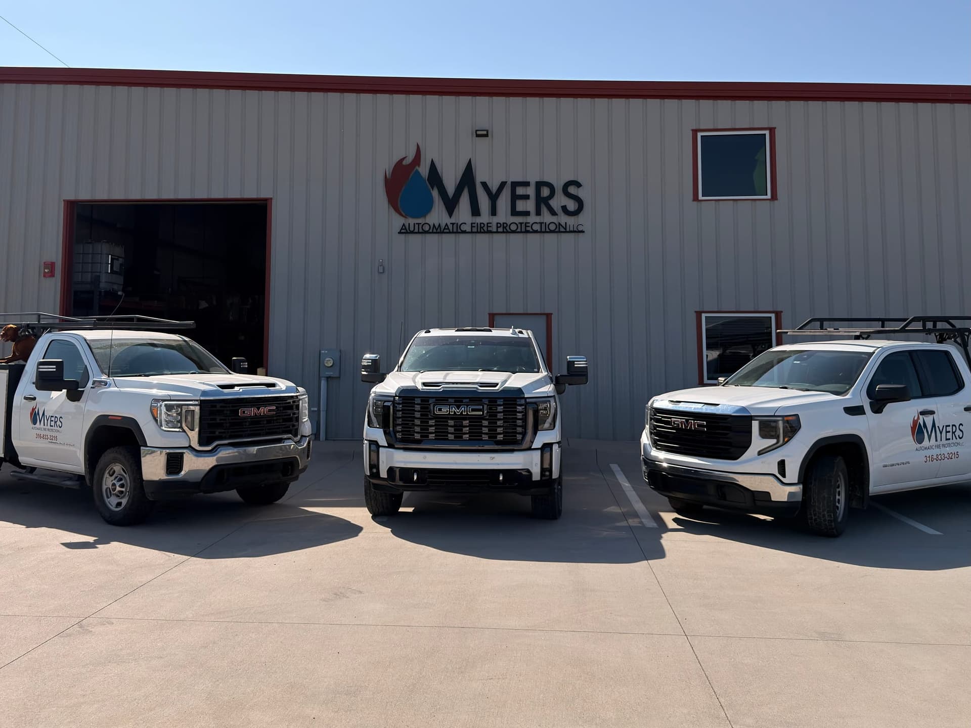 Myers AFP fire sprinkler service trucks parked outside the company shop in Wichita, Kansas